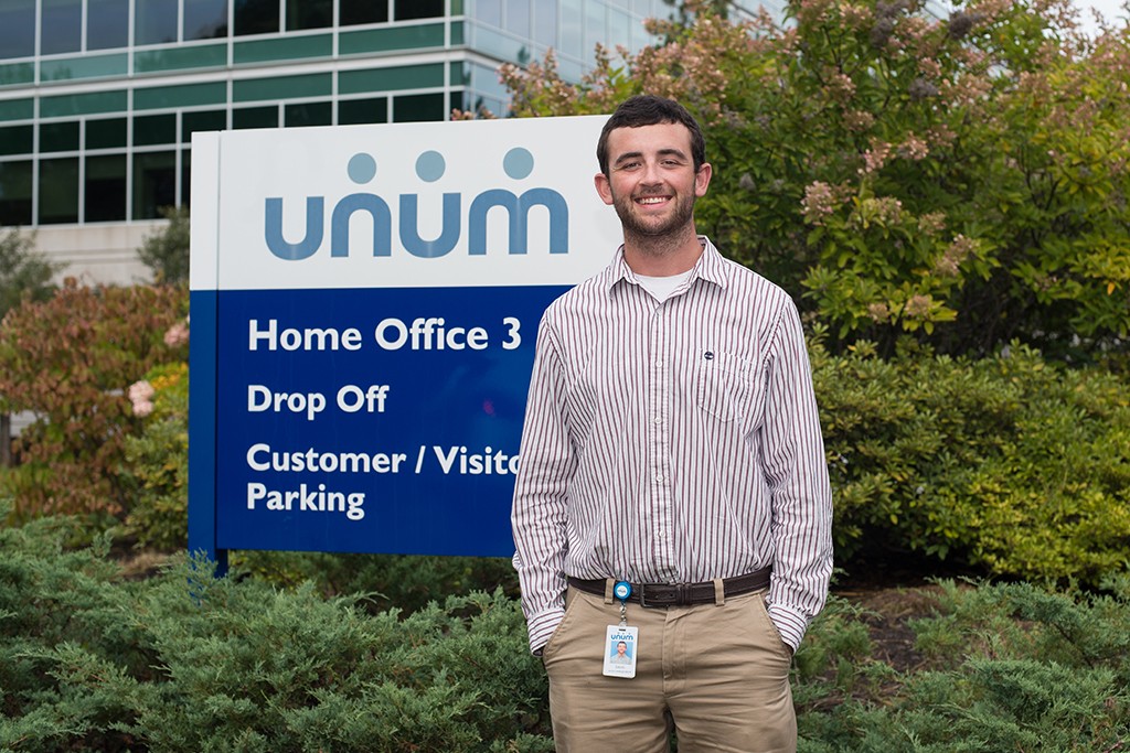 A U N E student at his internship site, Unum