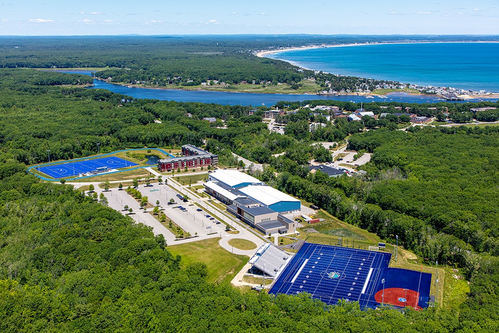 An aerial photo of the Biddeford Campus including the Saco River and Atlantic Ocean