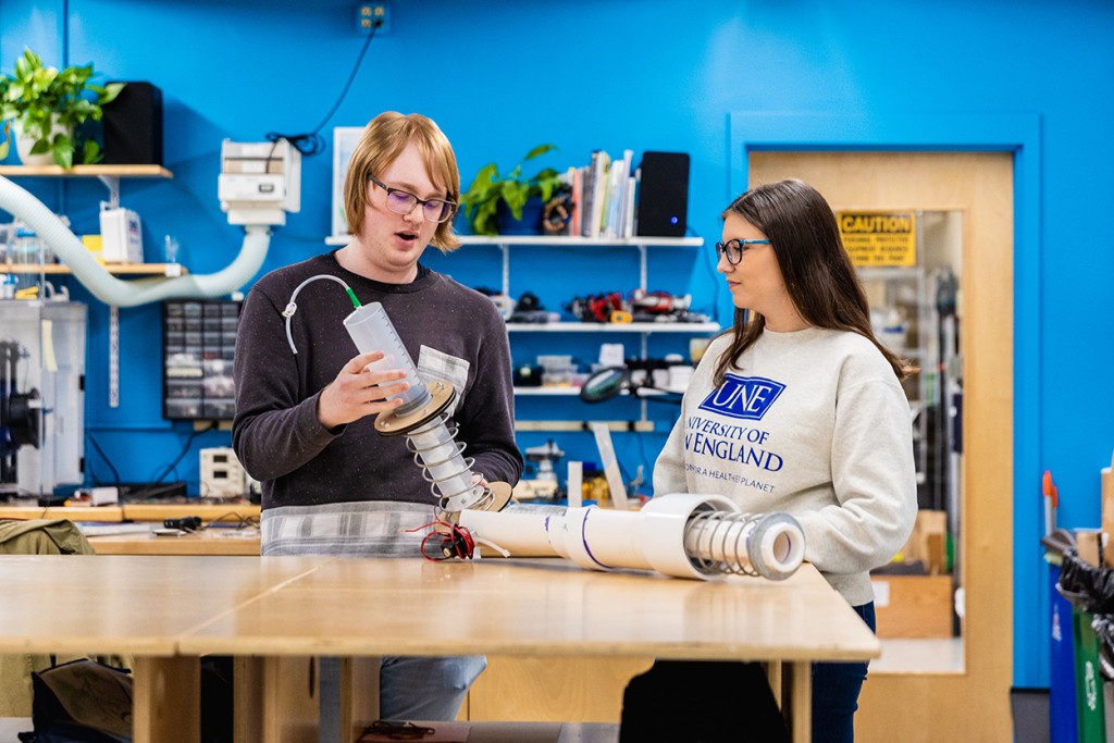 Two students discuss a project in the Makerspace