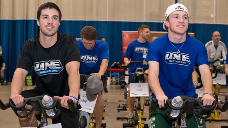 Several students cycling on stationary bikes during an event in Finley Recreation Center