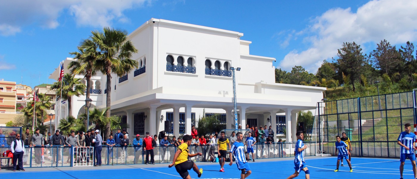 Playing soccer on 51小黄车Tangier, Morocco Blue Sports Court