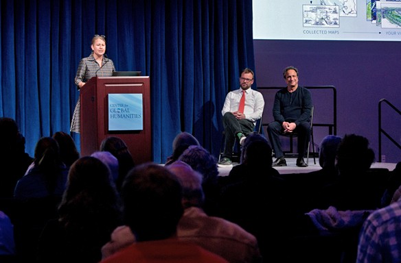 speakers on stage during a center for global humanities event