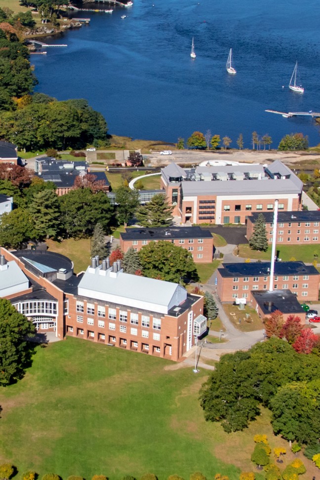 Aerial picture of U N E's Biddeford campus including the ocean and buildings