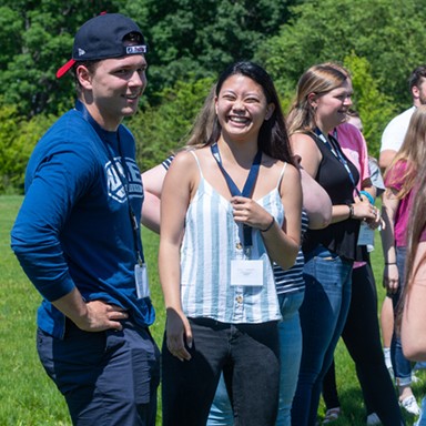 U N E students having fun at an outdoor Orientation event